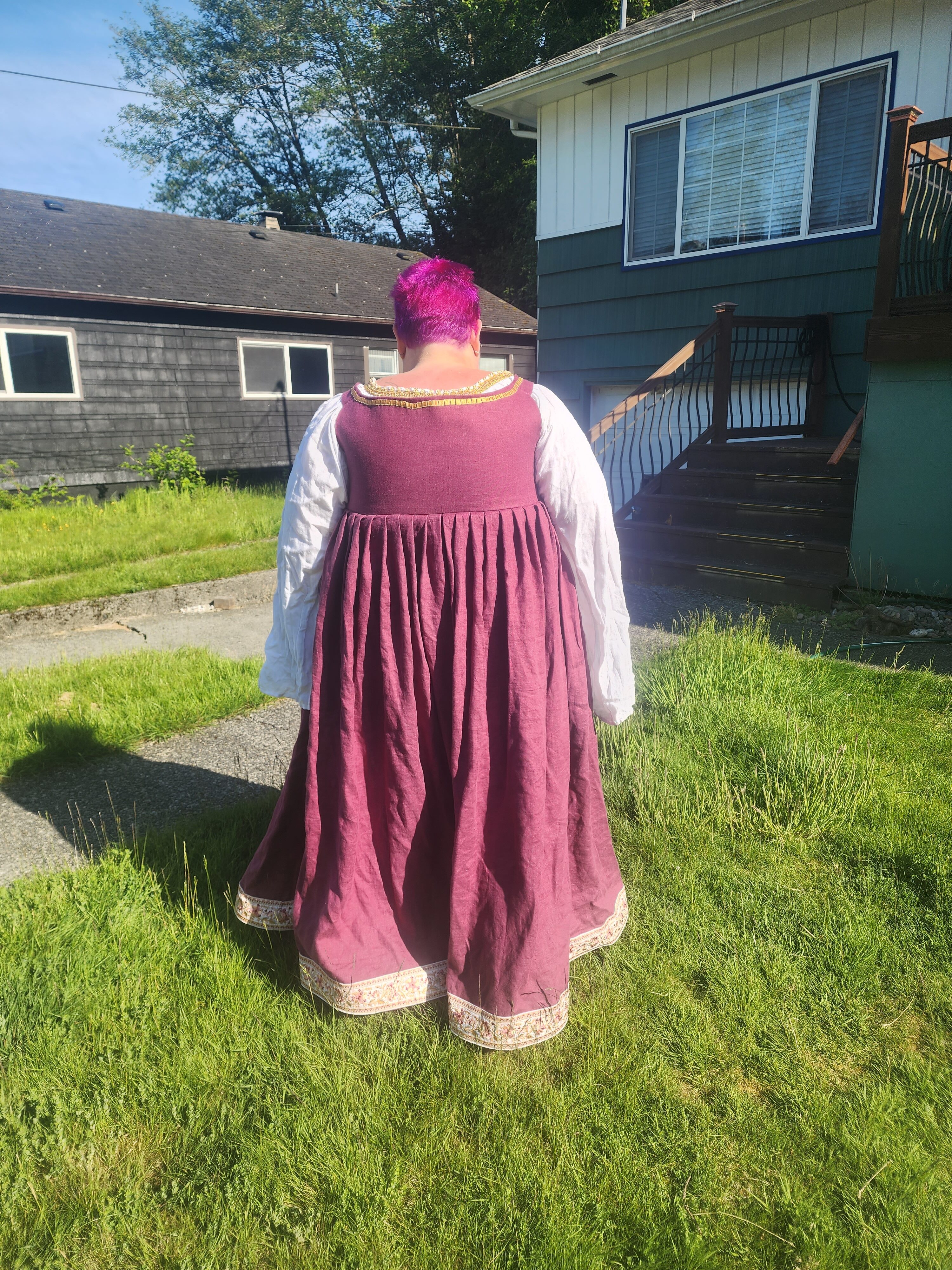 Back of dress on green grass lawn