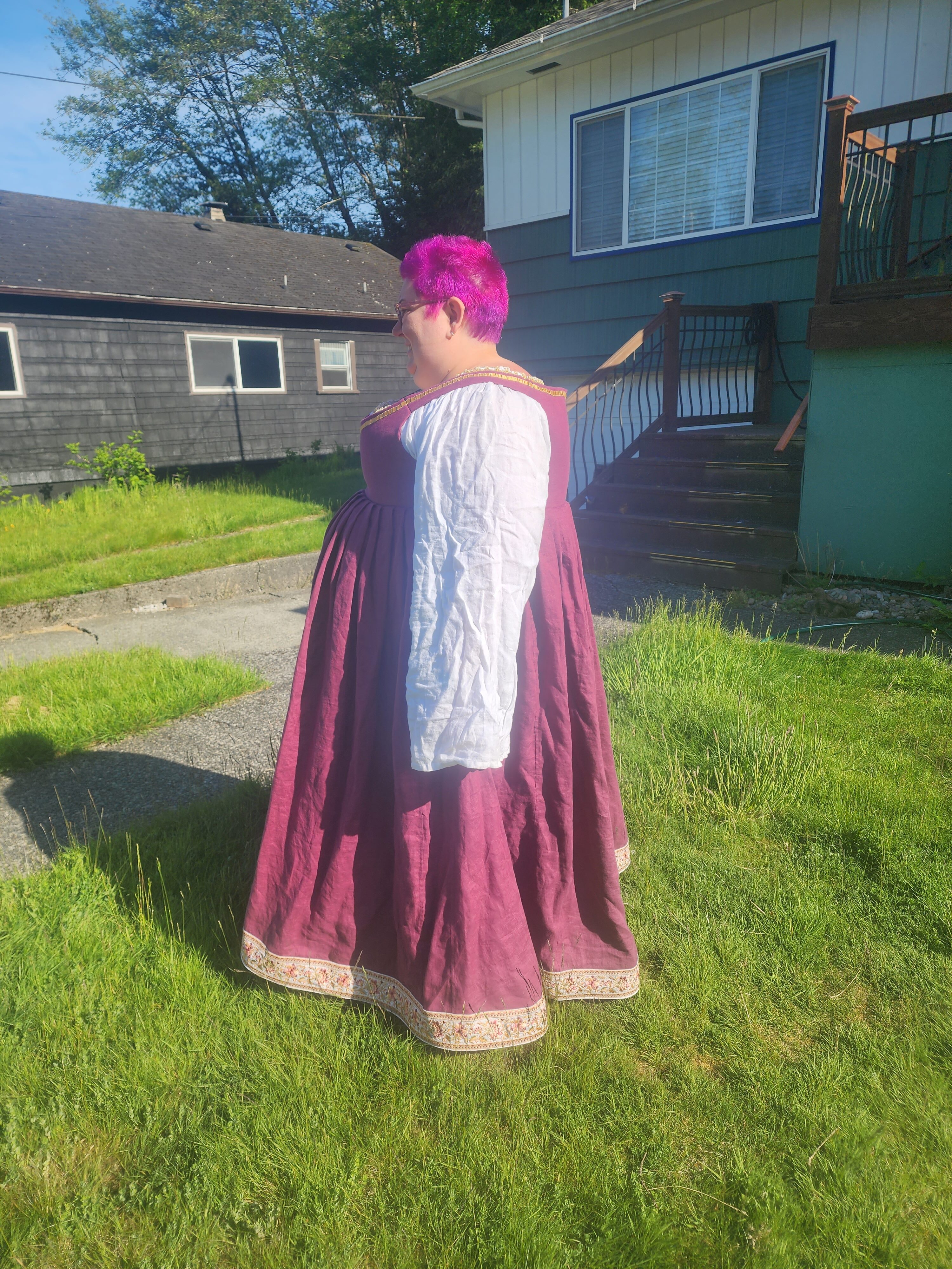 Side of dress as worn in a green grass lawn